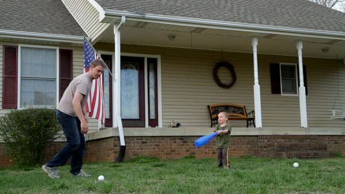 父亲和儿子打棒球亲子互动