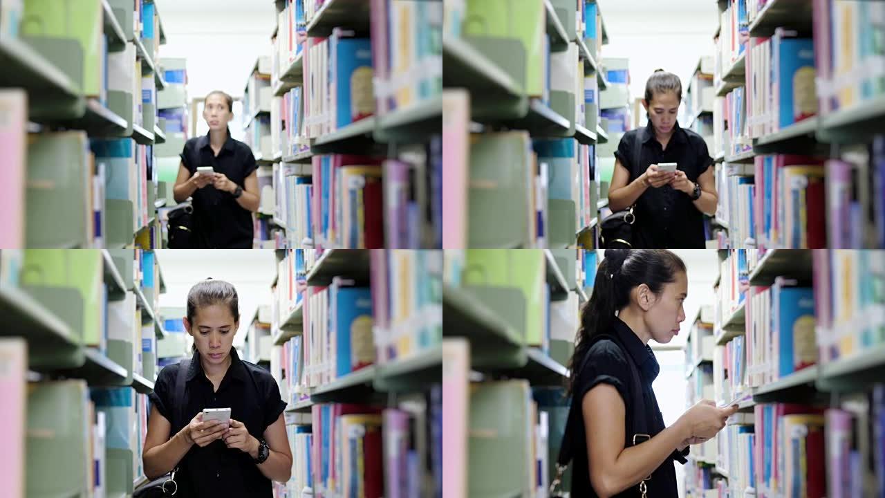 亚洲学生在图书馆看书。