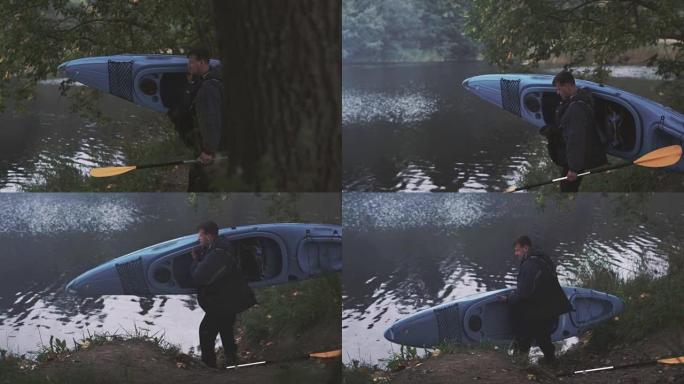 人类正把一艘蓝色皮划艇带到河边，并把它放在水上。