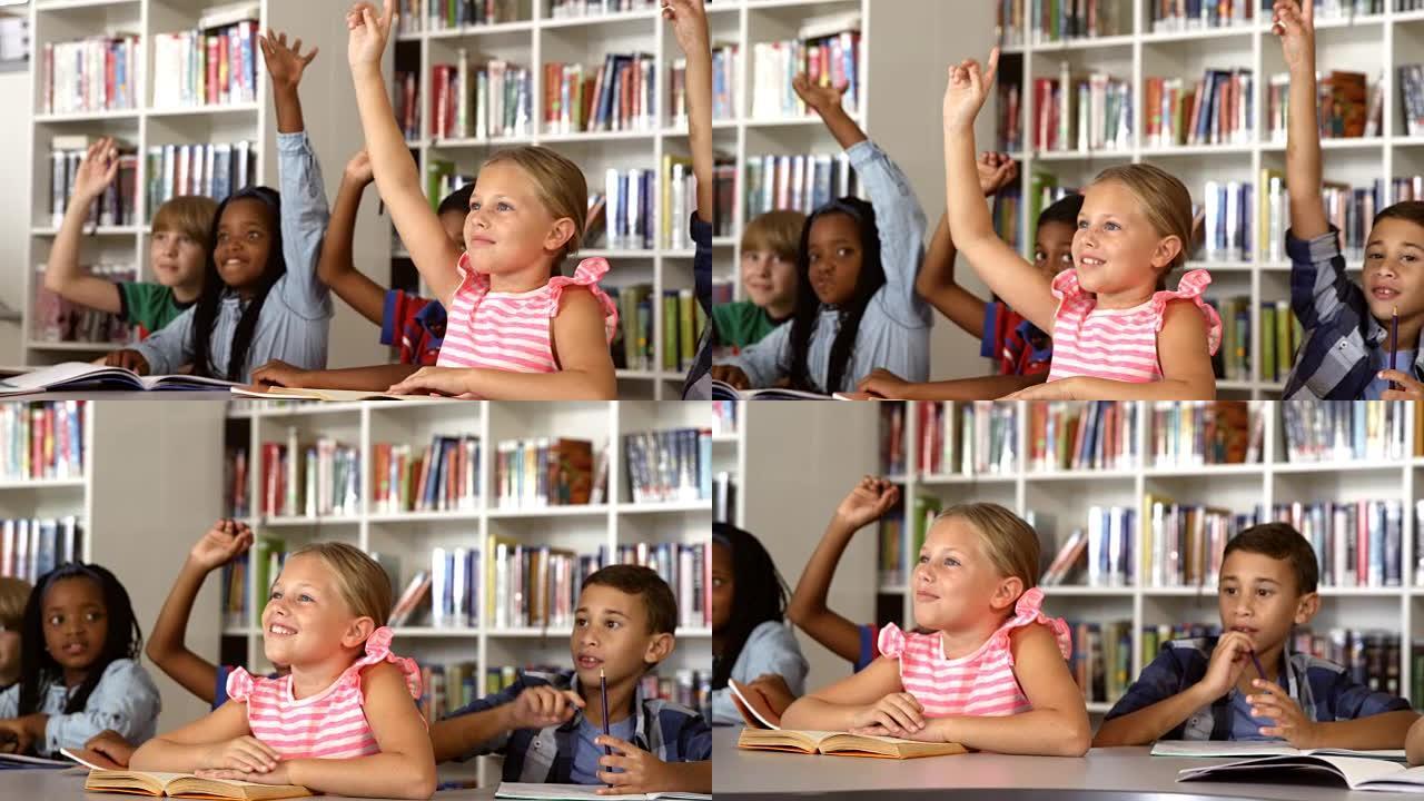 学校的孩子在图书馆里举手