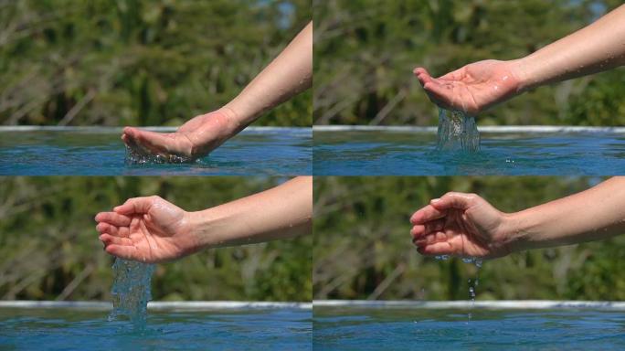 手玩水的慢动作细节，水滴掉进水池