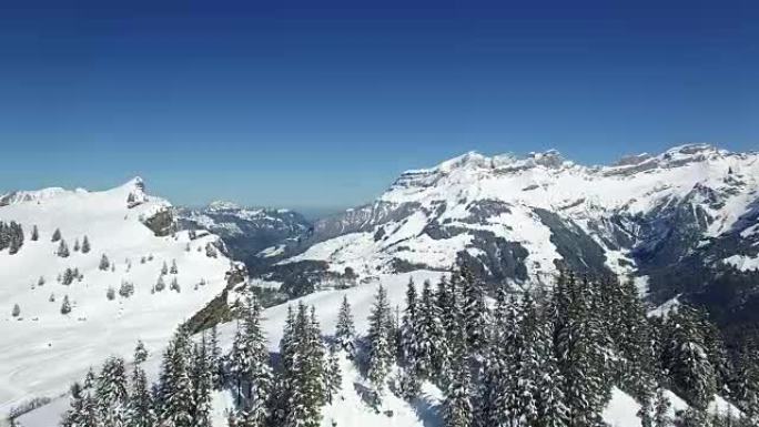 Aerial view of snow covered mountain range with be