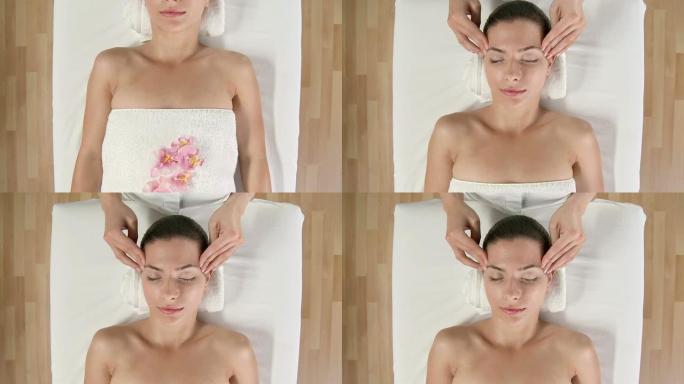 高清起重机: 女人在接受面部按摩时放松