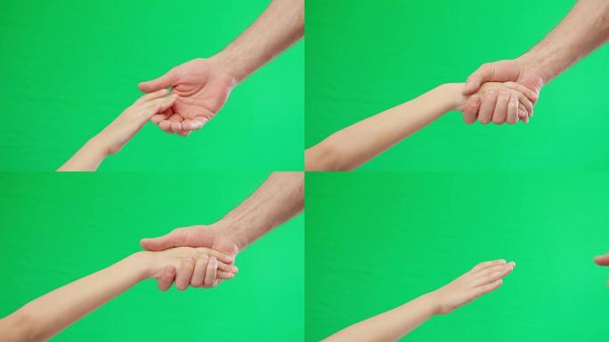 绿屏背景上的两只手牵手。