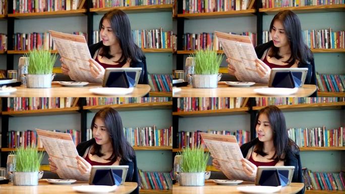 年轻的亚洲妇女正在阅读菜单