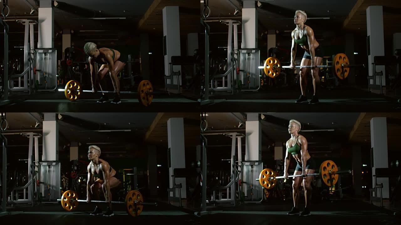 肌肉发达的女性健美运动员做杠铃硬拉