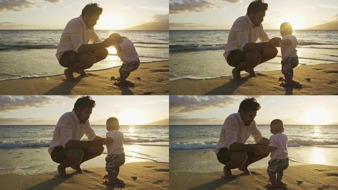 年轻的爸爸在海滩上与宝贝儿子玩耍