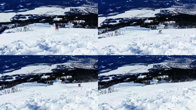 雪山上的人滑雪板
