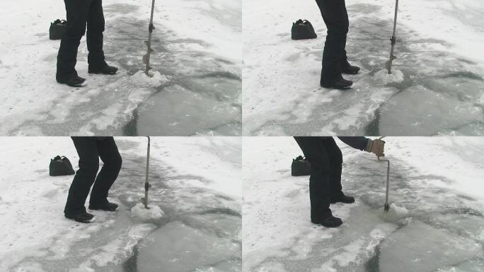 在冰上钻孔在冰上钻孔