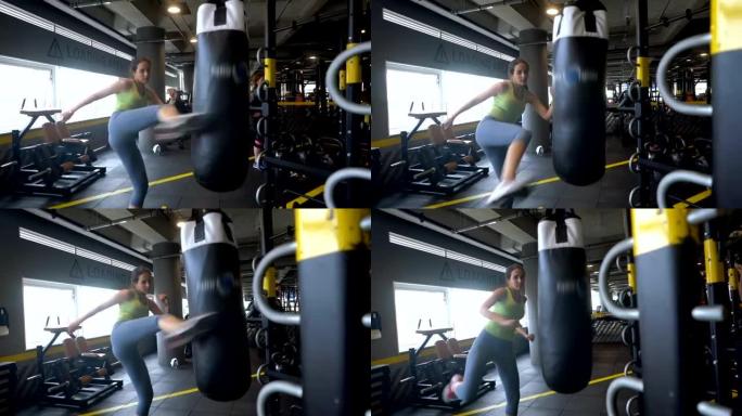 女人的慢动作跆拳道在健身房