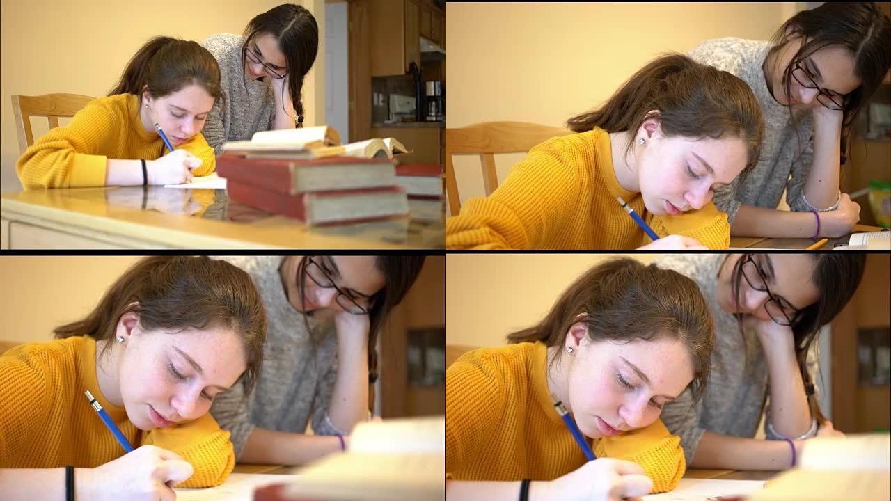 两个十几岁的女孩一起写作业