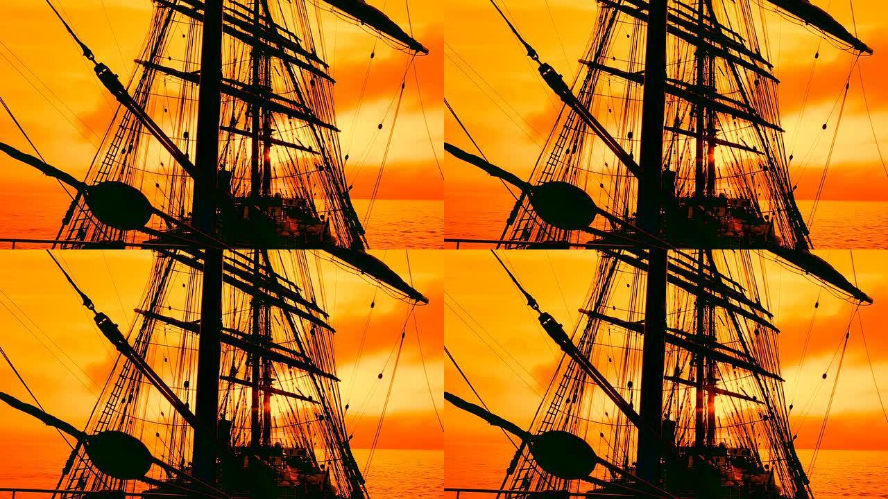 日落时一艘旧帆船的剪影