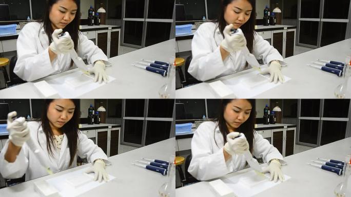 正面图：科学家使用微量移液管