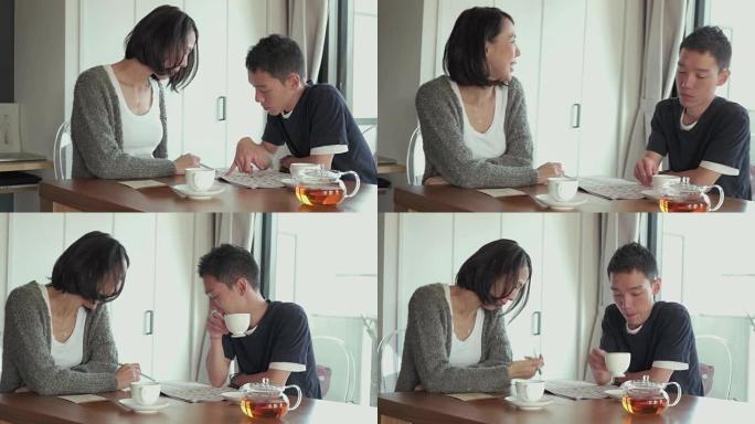 4K，选择性聚焦。年轻的父亲和母亲在客厅里聊天。日本东京