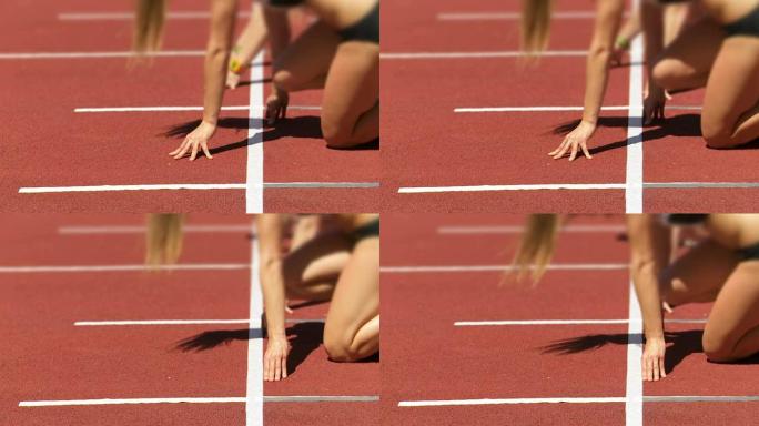 女短跑选手在起跑线CU SLO MO