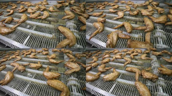 加工机上的熟鸡翅加工机上的熟鸡翅食品加工