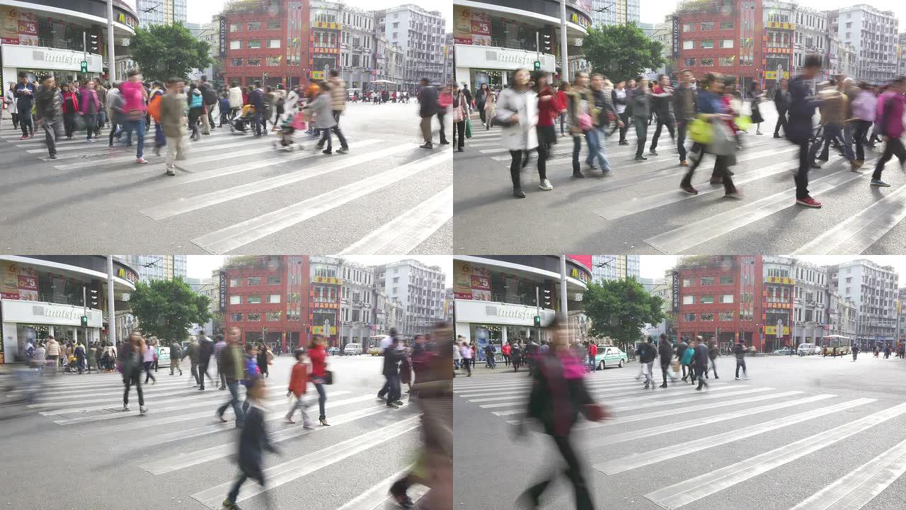 行人走过广州现代街道的人行横道，时间流逝