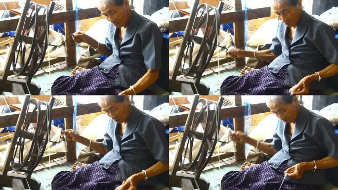 泰国妇女织线传统人文风情手工纺线手工艺品