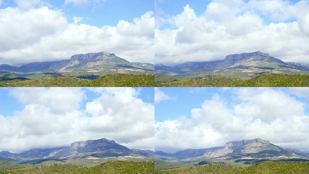 TIME-LAPSE拍摄的山脉上空云层形成的照片。