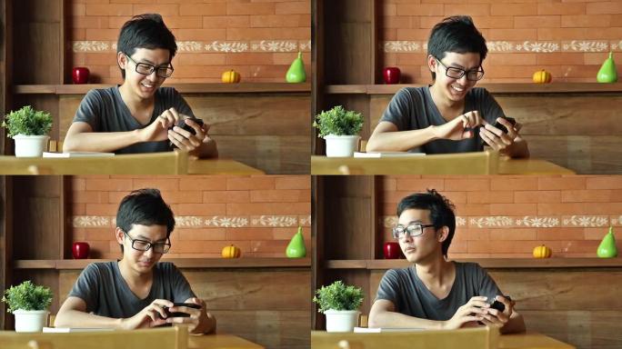 亚洲男子使用智能手机或平板电脑，等待某人