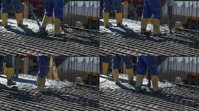 工人将混凝土引导至施工现场CU