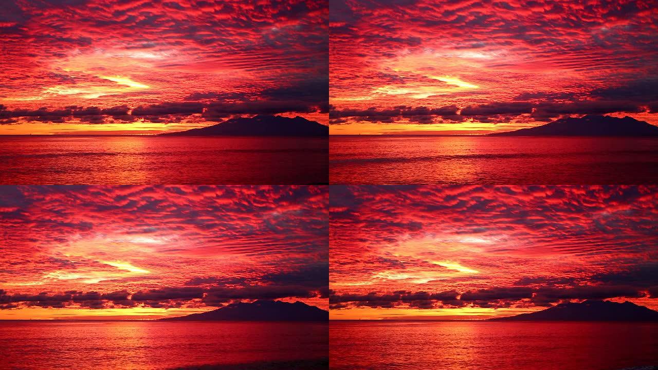 巴厘岛艾美德海岸海滩上美丽的红色日出