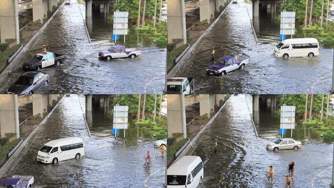 汽车在洪水泛滥的道路上行驶。