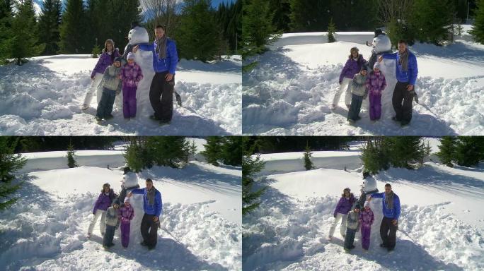 高清起重机: 与雪人合影的家庭