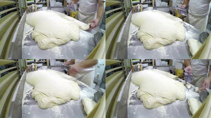 面包师切发酵面包面团