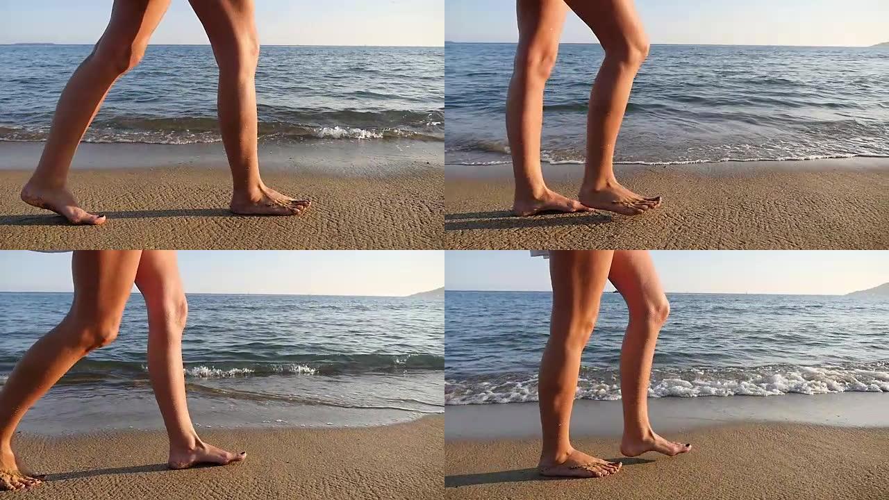 光滑的女性腿行走在美丽的海滩上