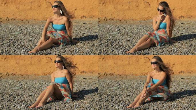 HD年轻女子坐在海边