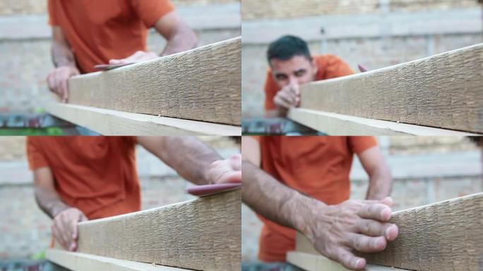 用砂纸在木板上工作