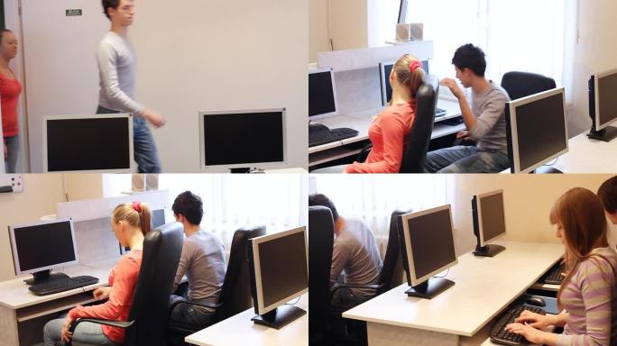 学生进入教室，坐在电脑前。