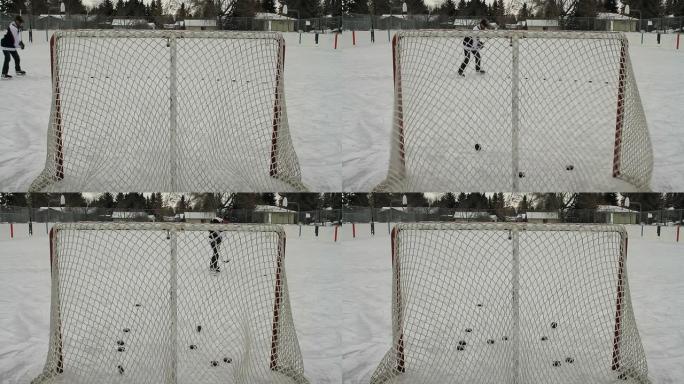 冰球运动员将冰球射入空网