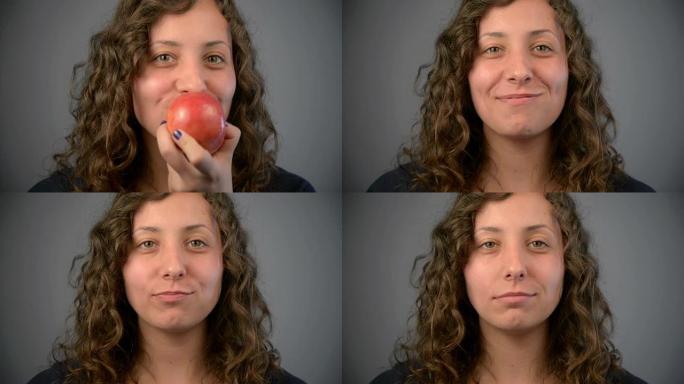 年轻的女人吃红苹果。