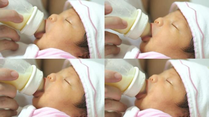 婴儿从奶瓶里吸奶健康宝宝照料婴儿婴儿护理