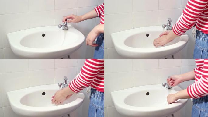 女性在HD厕所洗手。