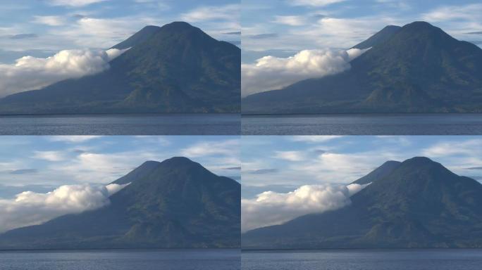 湖对面的双火山风平浪静死火山山峰山脉