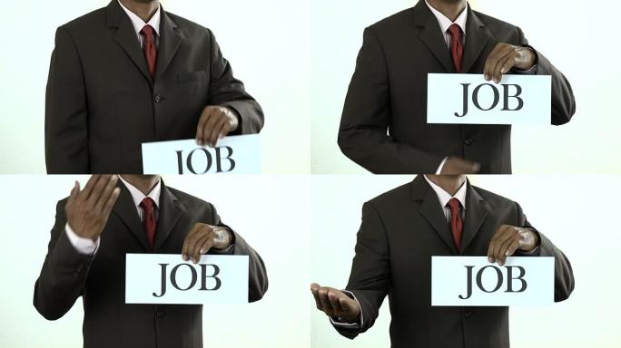 持有带工作标志的白卡的商人