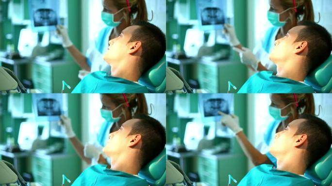 探长向患者展示x光图像。