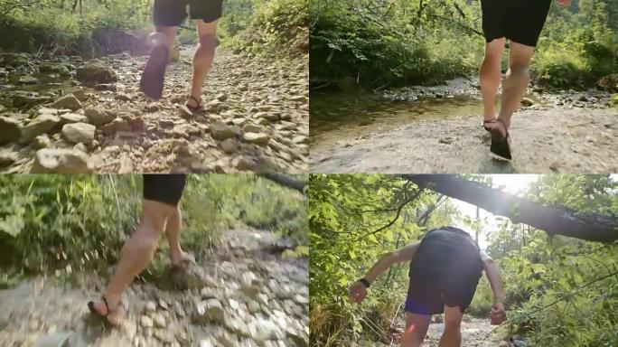 SLO MO TS赤脚跑步者在干燥的溪流中奔跑