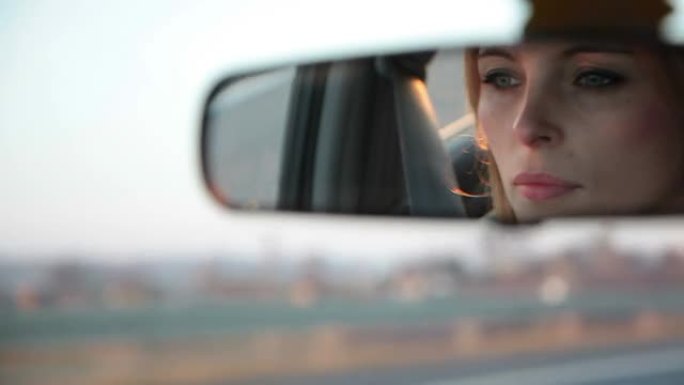 汽车后视镜中的女性视图