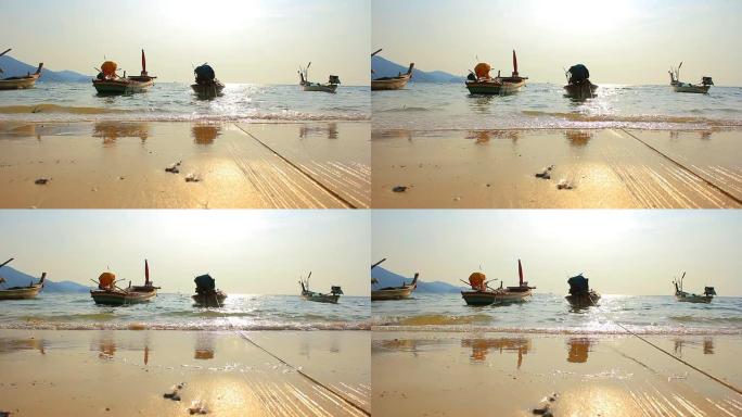 高清多莉: 日落海滩的长尾船