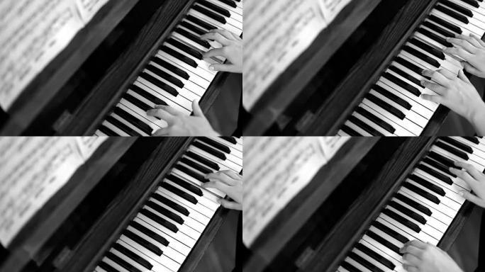 女手弹钢琴，黑白相间