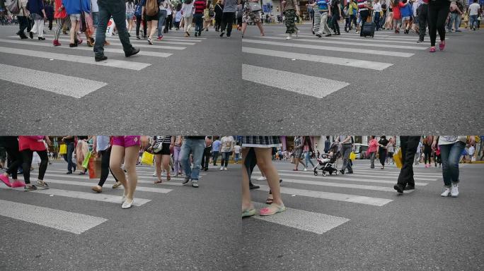 行人在城市街道斑马线行走，实时。