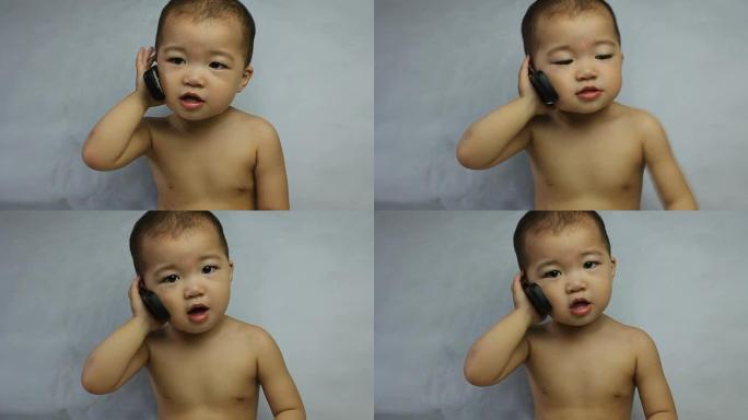 亚洲婴儿在手机上胡言乱语，CU