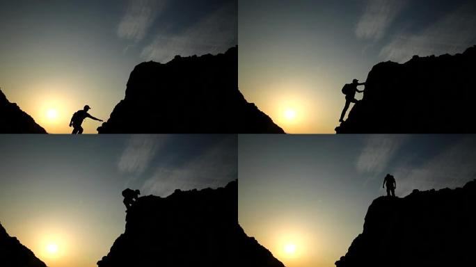 男性登山者在日落时的剪影。