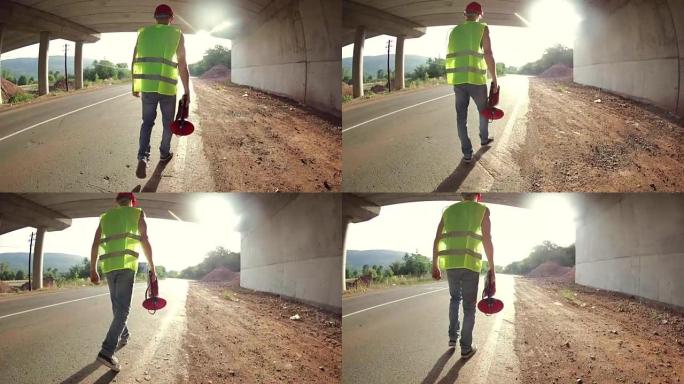 带扩音器的建筑工人