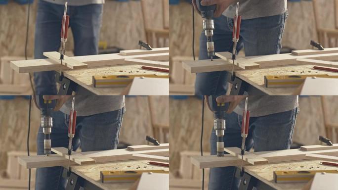 木匠在木头上钻孔木匠在木头上钻孔木工