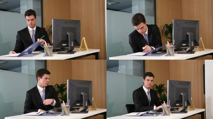 英俊的年轻商人从工作中抽出时间微笑